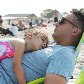 Location photography of father daughter at CT.beach relaxing. Photography campaign to promote Connecticut Tourism. 