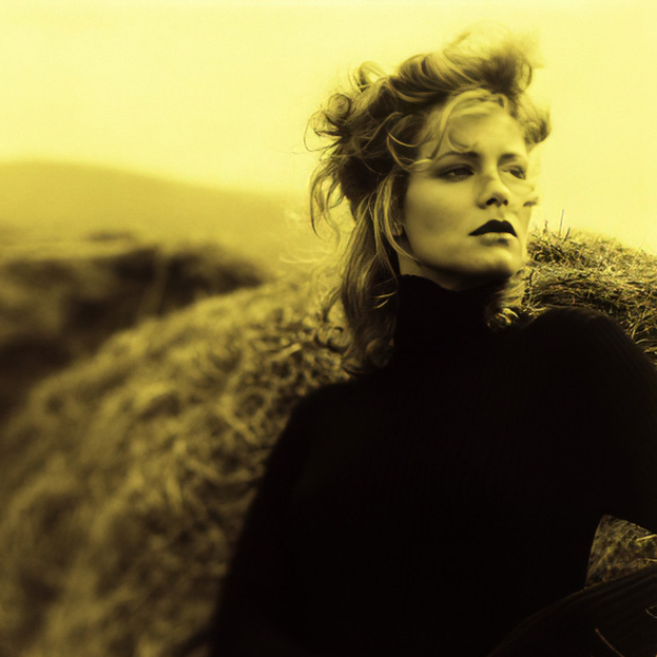 B&amp;W gold toned photo of fashion model with haystacks. Frank Marchese Photogrpahy